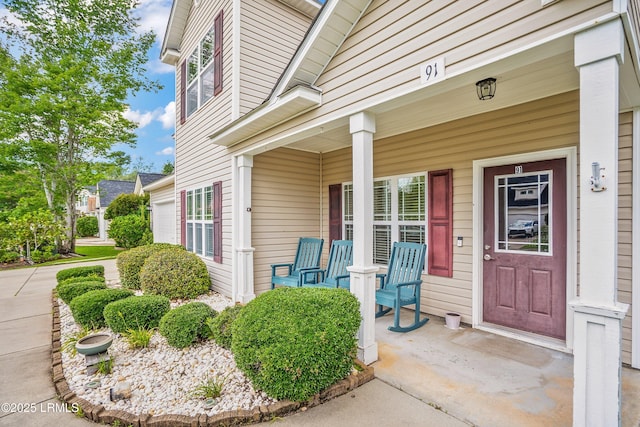 91 Heartstone Cir, Bluffton, SC 29910 - entrance to property with covered porch and a garage
