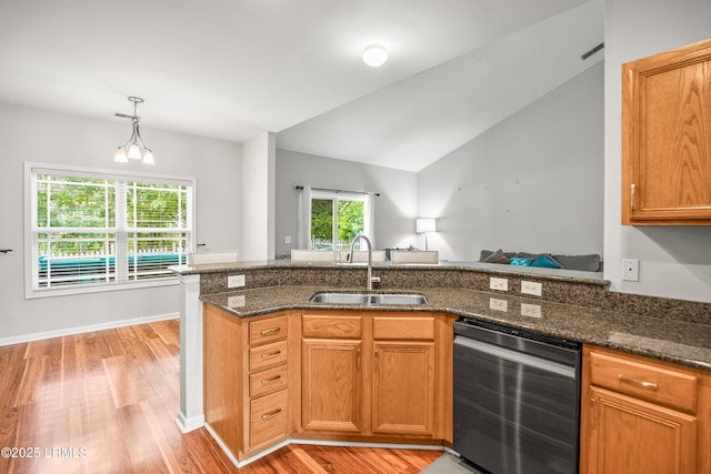 91 Heartstone Cir, Bluffton, SC 29910 - kitchen with dishwashing machine, light wood-type flooring, dark stone counters, decorative light fixtures, and open floor plan