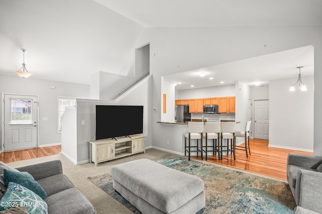 91 Heartstone Cir, Bluffton, SC 29910 - living area featuring high vaulted ceiling and light wood-style floors