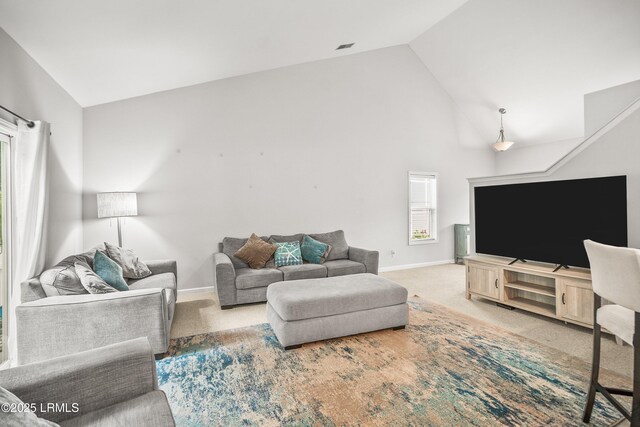 91 Heartstone Cir, Bluffton, SC 29910 - carpeted living area featuring high vaulted ceiling and baseboards
