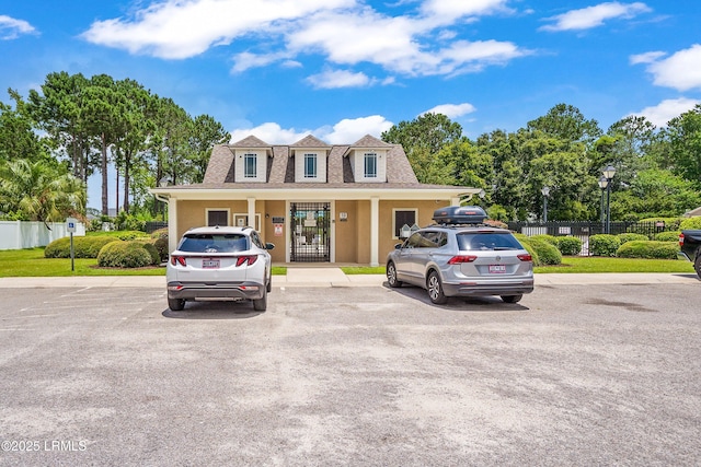 91 Heartstone Cir, Bluffton, SC 29910 - view of front of house with uncovered parking, stucco siding, and a shingled roof