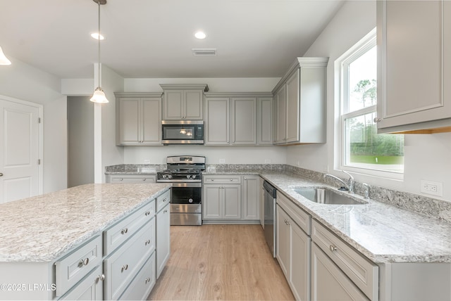 1109 Salty Hammock Ct, Beaufort, SC 29902 - kitchen with stainless steel appliances, gray cabinets, plenty of natural light, light wood-style flooring, and recessed lighting