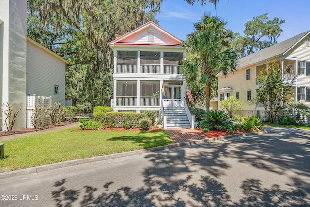 8 Battery Point Ln, Beaufort, SC 29902 - view of front of property featuring a sunroom, stairway, and a front yard