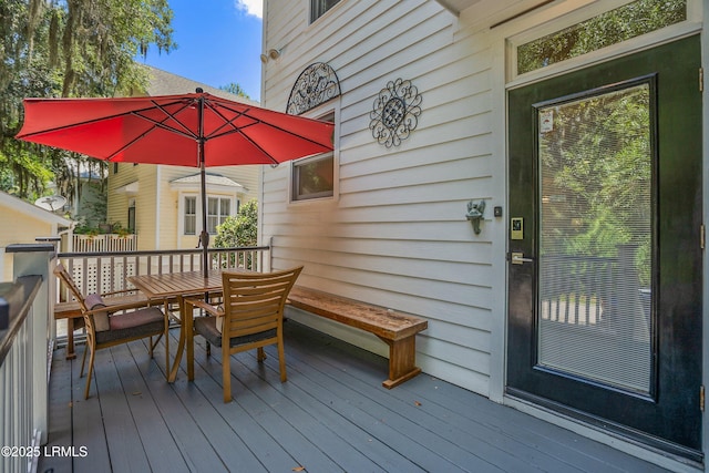 8 Battery Point Ln, Beaufort, SC 29902 - wooden terrace with outdoor dining area