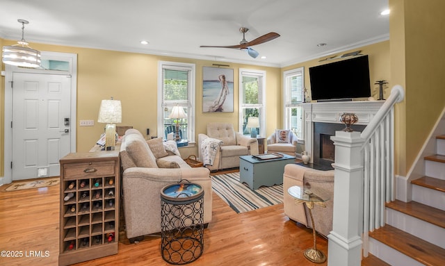 8 Battery Point Ln, Beaufort, SC 29902 - living area featuring crown molding, light wood-style flooring, stairway, a ceiling fan, and recessed lighting
