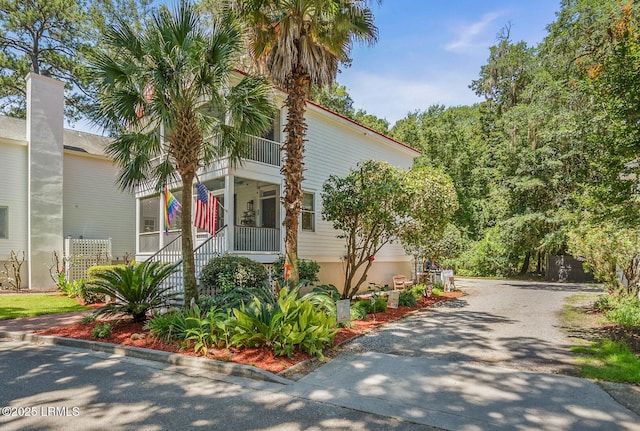 8 Battery Point Ln, Beaufort, SC 29902 - view of front of house featuring driveway and a balcony