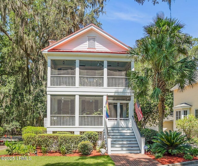 8 Battery Point Ln, Beaufort, SC 29902 - view of front facade with a sunroom and stairs
