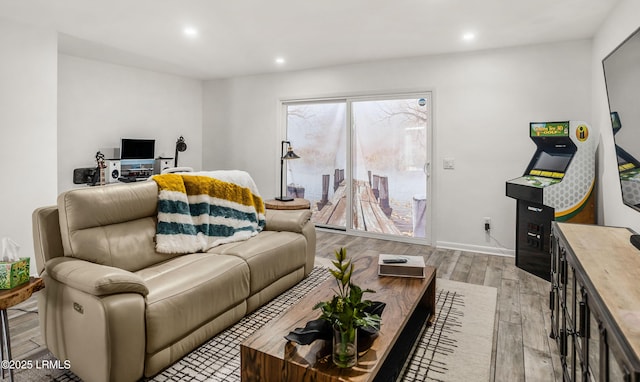 living room with light hardwood / wood-style flooring