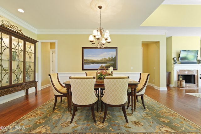 19 Lynnfield Pl, Bluffton, SC 29910 - dining room with a chandelier, ornamental molding, wood finished floors, and a high end fireplace