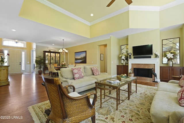 19 Lynnfield Pl, Bluffton, SC 29910 - living room featuring a chandelier, wood finished floors, a premium fireplace, crown molding, and recessed lighting