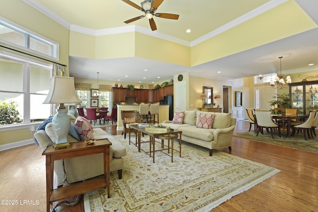 19 Lynnfield Pl, Bluffton, SC 29910 - living room with a chandelier, a ceiling fan, wood finished floors, crown molding, and recessed lighting
