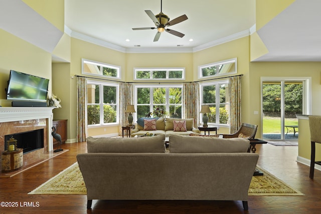19 Lynnfield Pl, Bluffton, SC 29910 - living area featuring crown molding, a premium fireplace, a ceiling fan, a high ceiling, and recessed lighting