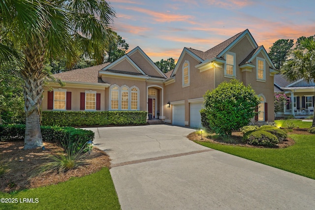 19 Lynnfield Pl, Bluffton, SC 29910 - traditional-style home with concrete driveway, stucco siding, and a garage
