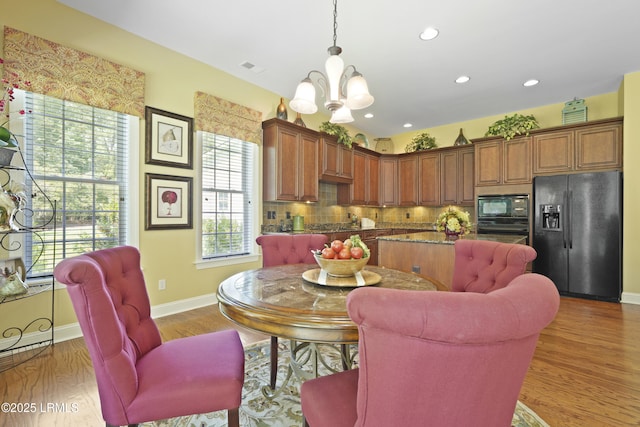 19 Lynnfield Pl, Bluffton, SC 29910 - dining space with a chandelier, wood finished floors, and recessed lighting