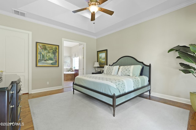 19 Lynnfield Pl, Bluffton, SC 29910 - bedroom featuring wood finished floors, crown molding, a raised ceiling, ensuite bathroom, and a ceiling fan