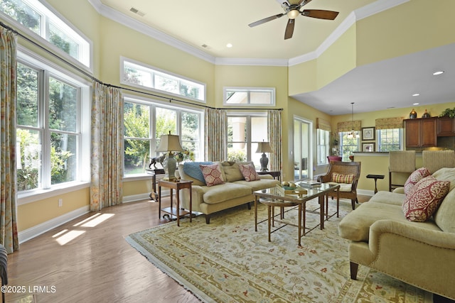 19 Lynnfield Pl, Bluffton, SC 29910 - living area with a ceiling fan, a towering ceiling, crown molding, light wood-type flooring, and recessed lighting