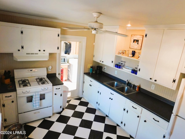 kitchen with sink, white appliances, crown molding, ceiling fan, and white cabinetry