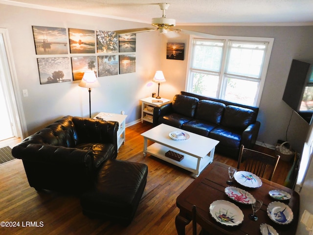 living room featuring wood-type flooring, ornamental molding, and ceiling fan