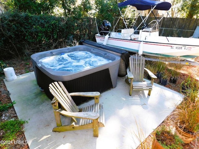 view of patio / terrace with a hot tub