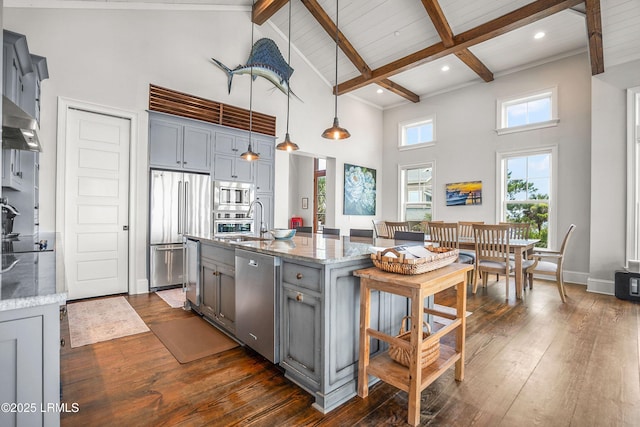 517 Tarpon Blvd, Fripp Island, SC 29920 - kitchen featuring appliances with stainless steel finishes, gray cabinetry, a towering ceiling, dark wood-type flooring, and beamed ceiling