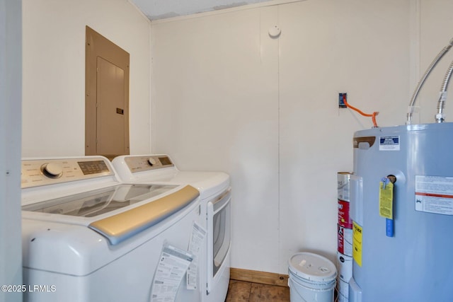 washroom featuring electric panel, washing machine and dryer, and water heater