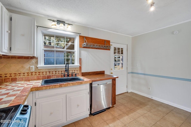 kitchen with sink, dishwasher, stove, tile counters, and white cabinets