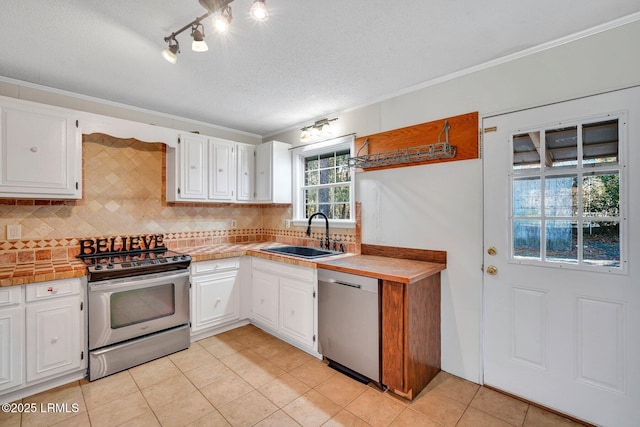 kitchen with white cabinetry, sink, and stainless steel appliances