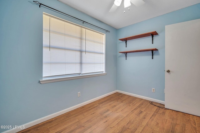 spare room featuring ceiling fan and light hardwood / wood-style floors