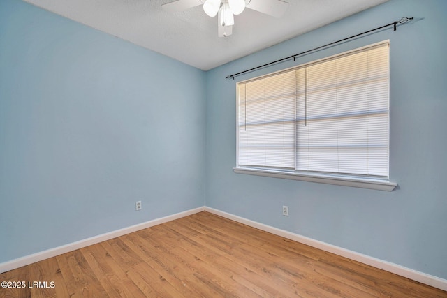 unfurnished room with ceiling fan and light hardwood / wood-style floors