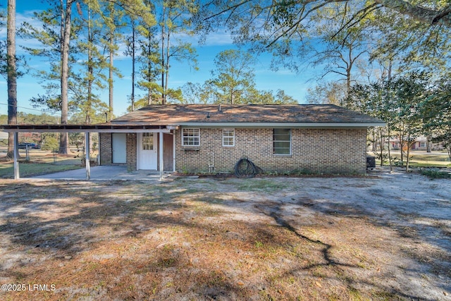 back of property featuring a yard and a patio area