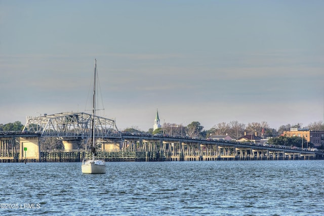 property view of water with a pier