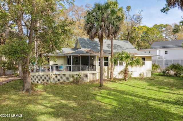 838 Fiddlers Ridge Rd, Fripp Island, SC 29920 - back of property featuring a sunroom, a yard, roof with shingles, and a deck