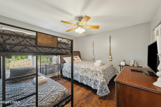 bedroom featuring dark wood-style flooring and a ceiling fan