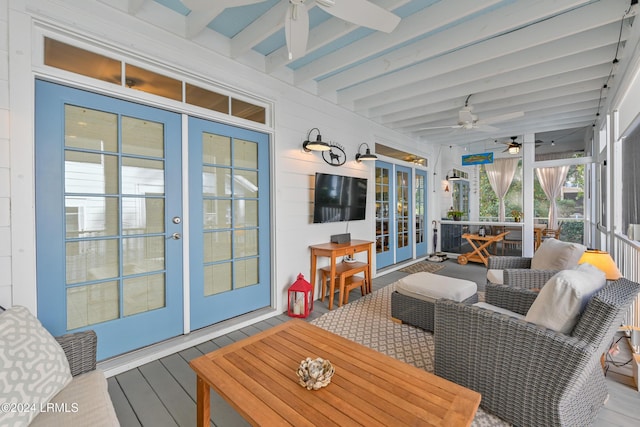 sunroom featuring ceiling fan, french doors, and beamed ceiling