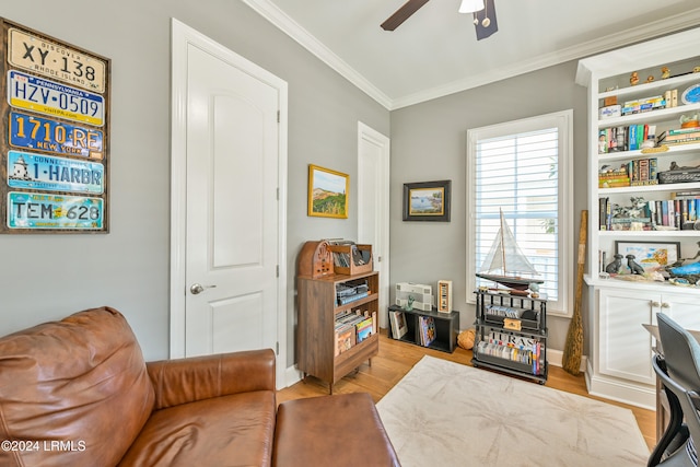 office with crown molding, light hardwood / wood-style floors, and ceiling fan