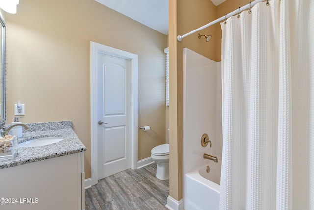 full bathroom featuring hardwood / wood-style flooring, vanity, toilet, and shower / bath combo with shower curtain