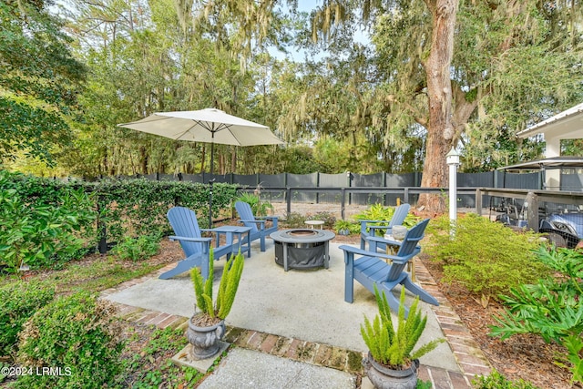 view of patio / terrace with an outdoor fire pit