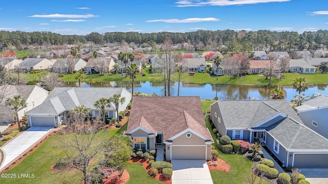 aerial view with a residential view and a water view