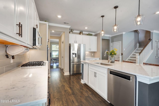122 Bedstone Ct, Bluffton, SC 29909 - kitchen with crown molding, white cabinetry, appliances with stainless steel finishes, a sink, and decorative backsplash