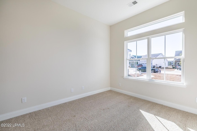 unfurnished room featuring carpet