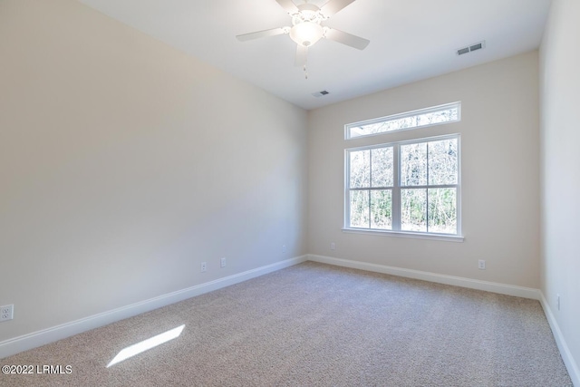 carpeted empty room with ceiling fan