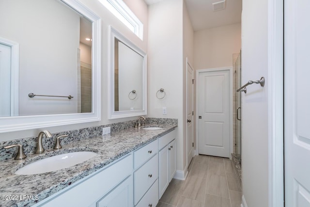 bathroom featuring vanity and walk in shower