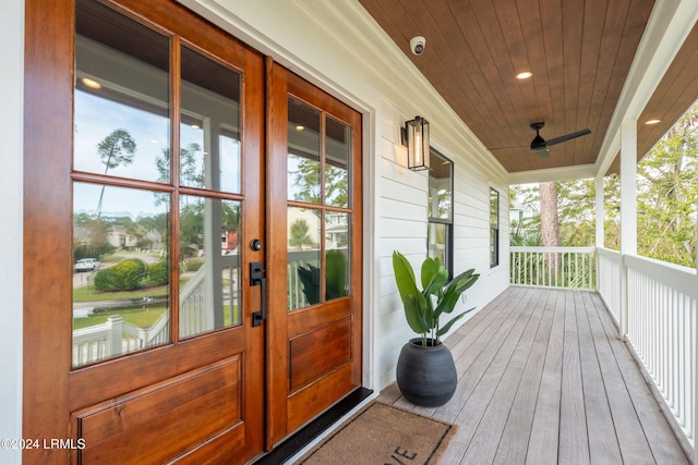 entrance to property featuring french doors and ceiling fan