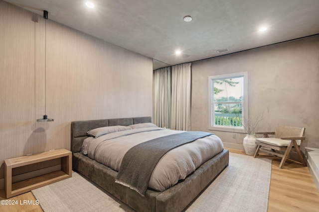 bedroom with hardwood / wood-style floors