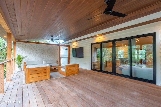 deck with an outdoor hangout area and ceiling fan