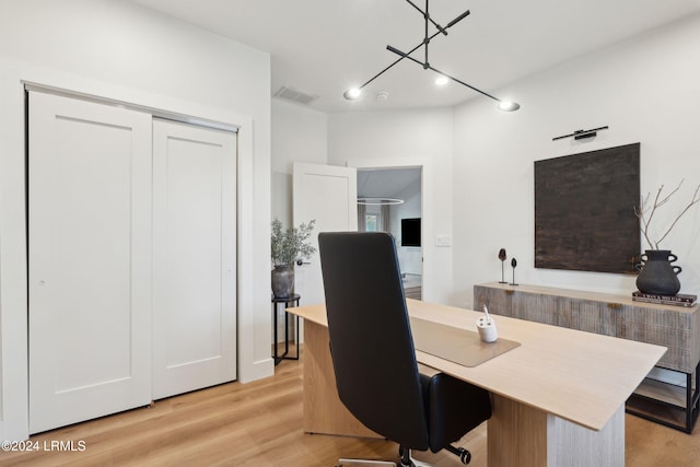 office with light hardwood / wood-style floors