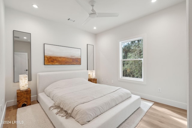 bedroom with light wood-type flooring and ceiling fan