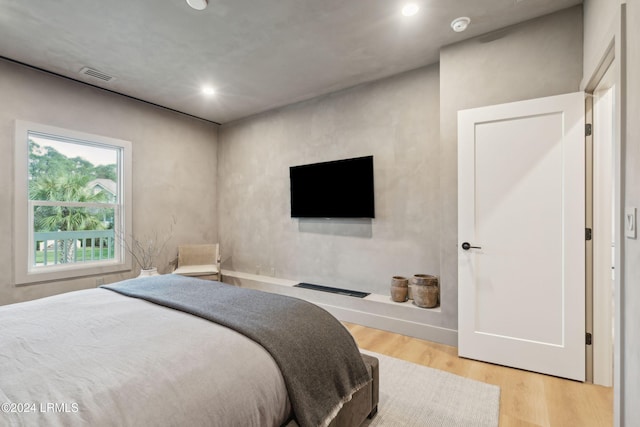 bedroom featuring wood-type flooring