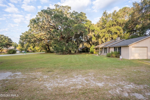 view of yard with a garage