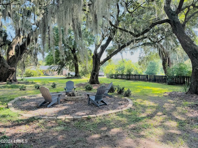 view of yard with a fire pit